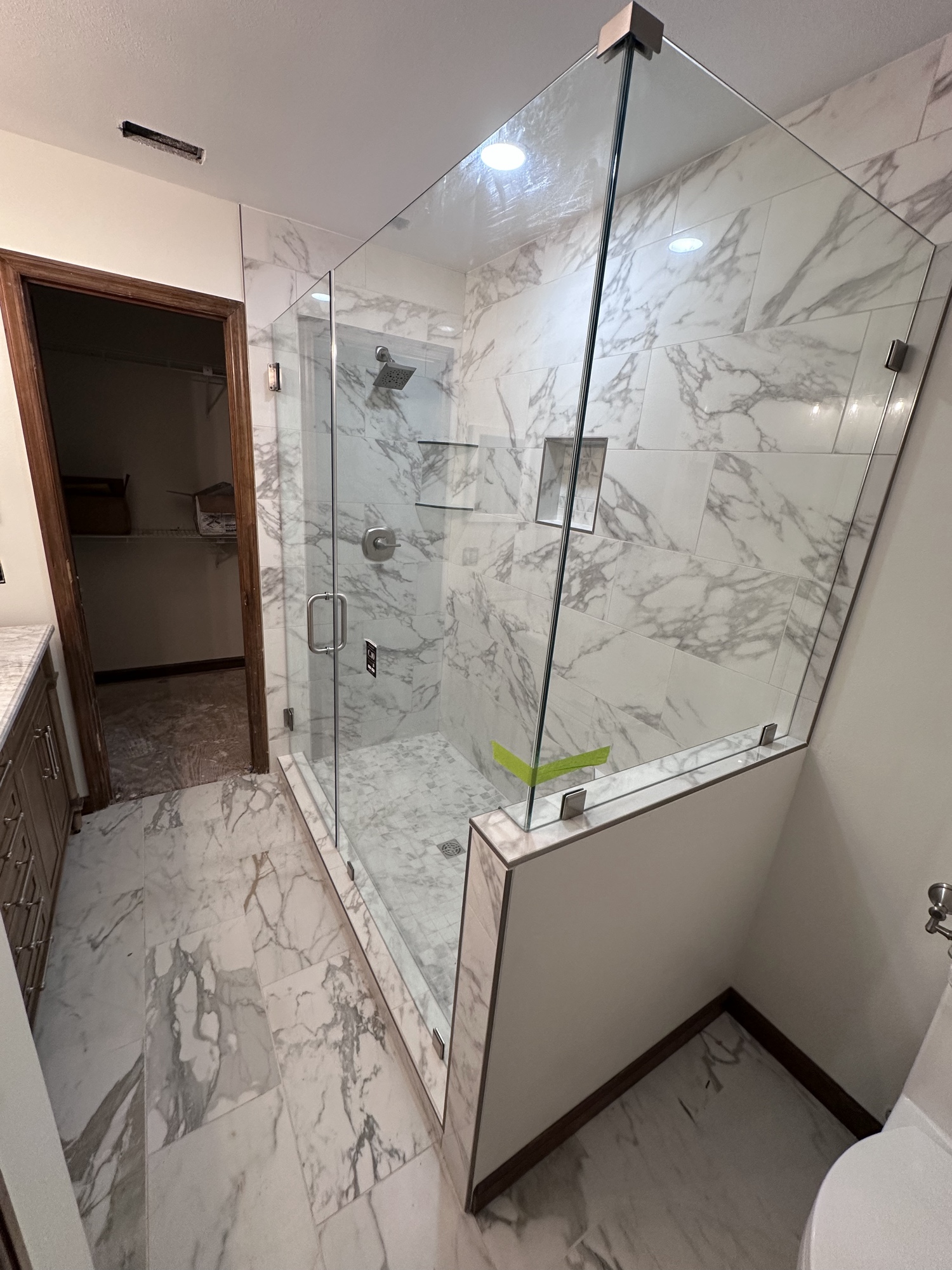 Glass-enclosed marble shower